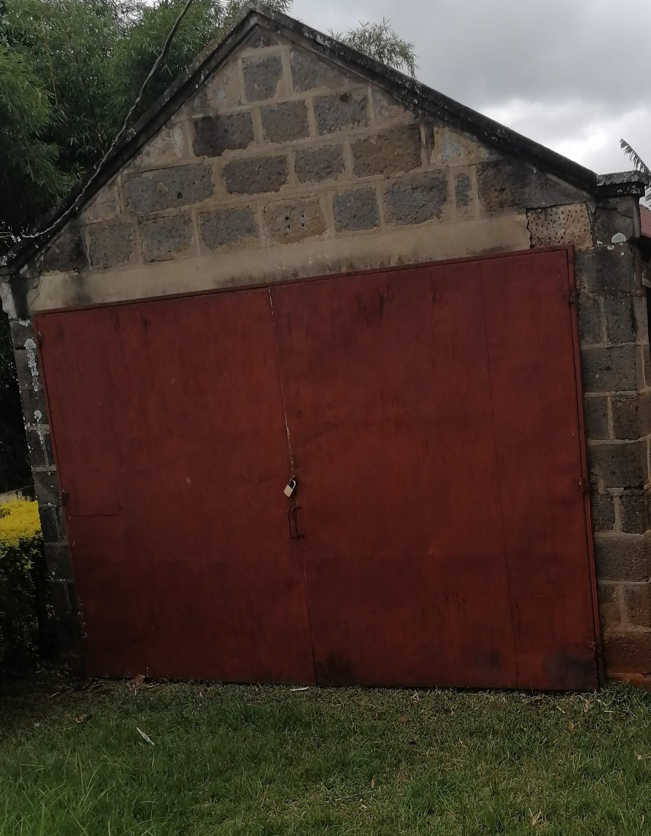 Closed Mechanics Garage in Mr. and Mrs. Harry Thuku's Greek Mansion Compound
